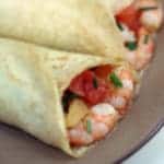 Crepes filled with shrimp, tomato, and chives