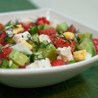 Israeli salad with cucumbers, tomatoes, dill, hard boiled egg, and feta cheese