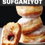Pinterest pin for sufganiyot or jelly donuts for hanukkah. text says israeli jelly donuts sufganiyot. image shows a stack of 3 jelly donuts on a white plate. There is a fourth jelly donut leaning agains the stack. the fourth donut has a bite taken out so you can see the jelly in the center.