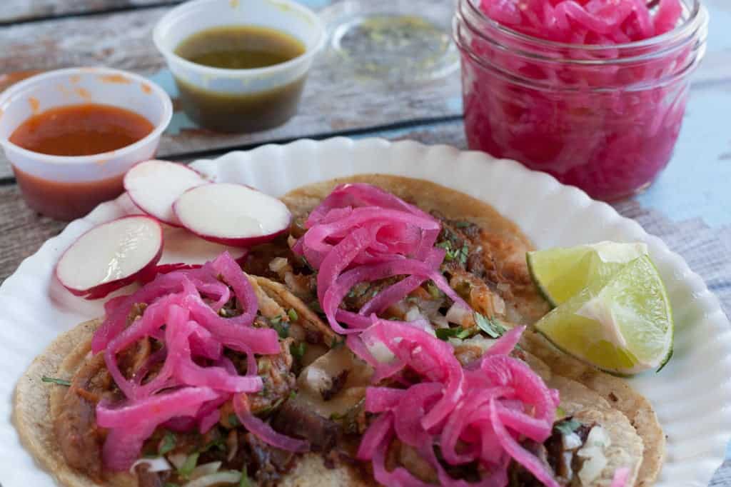 Pickled onions in lime juice on tacos