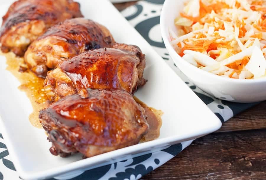 honey sriracha glazed chicken thighs on a serving platter
