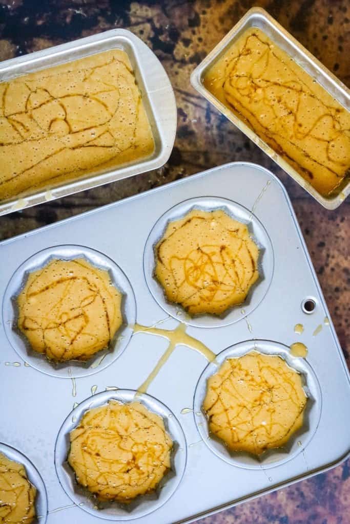 A muffin tin filled with honey cake muffins.