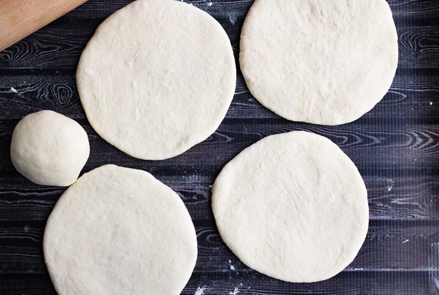 Dough rolled out into disks.
