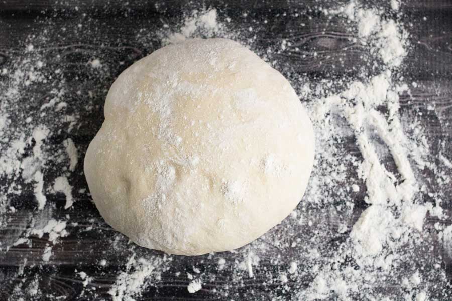 Balled dough with flour.