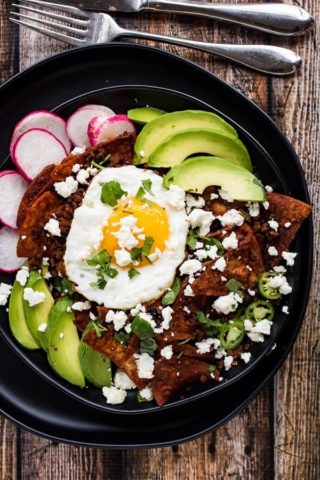 Mexican chilaquiles with avocado and an egg.