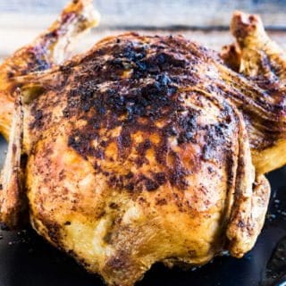 A whole chicken cooked in an air fryer--crispy-skinned, succulent, and flavorful