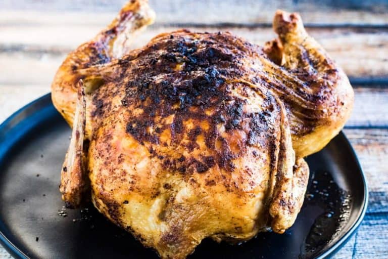 A whole chicken cooked in an air fryer--crispy-skinned, succulent, and flavorful