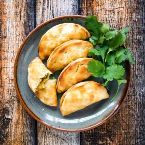 Thai curry puffs served with parsley.