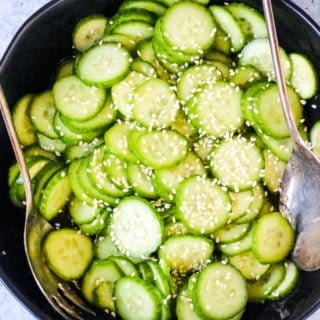 Japanese cucumber salad ready to serve in a black salad bowl