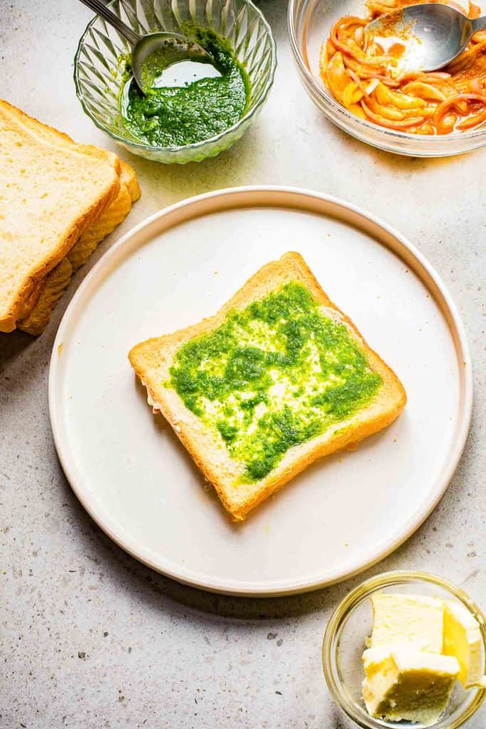 A slice of bread with butter and chutney.