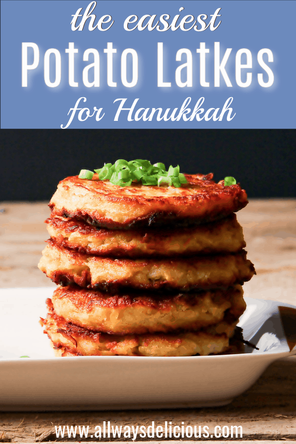 Pinterest pin for potato latkes. Text says the easiest potato latkes for hannukah. The photo shows a low angle photo of a stack of 5 potato latkes on a white rectangular plate. There is a bowl of sour cream on the plate and both the sour cream and potato latkes are garnished with sliced green onions.