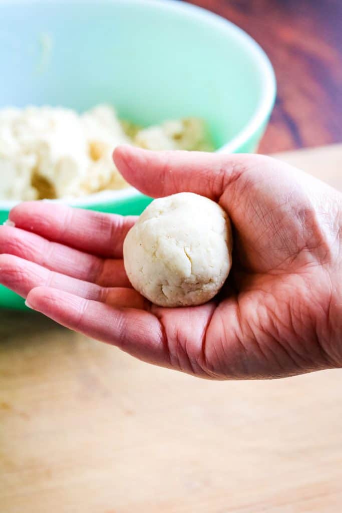 ball of corn tortilla dough in a hand