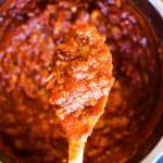 cooked meat sauce in the instant pot with a wooden spoon