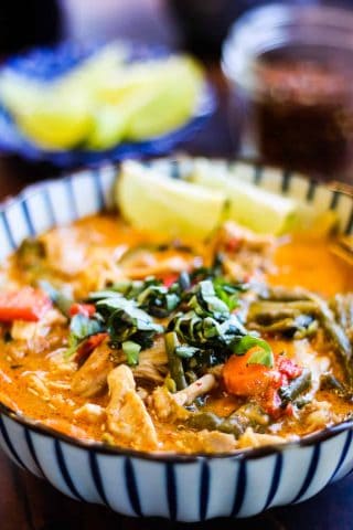 thai curry chicken with coconut milk and red curry paste shot from a low angle