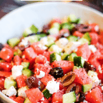 pinterest pin for watermelon salad with cucumbers, feta, and olives