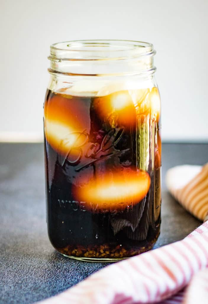 Eggs in a jar with soy sauce brine.