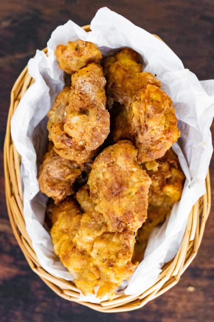 Overhead shot of air fried chicken in a basket.