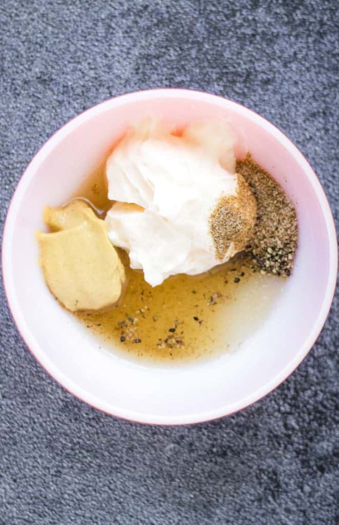 A creamy bowl with whipped cream and spices.