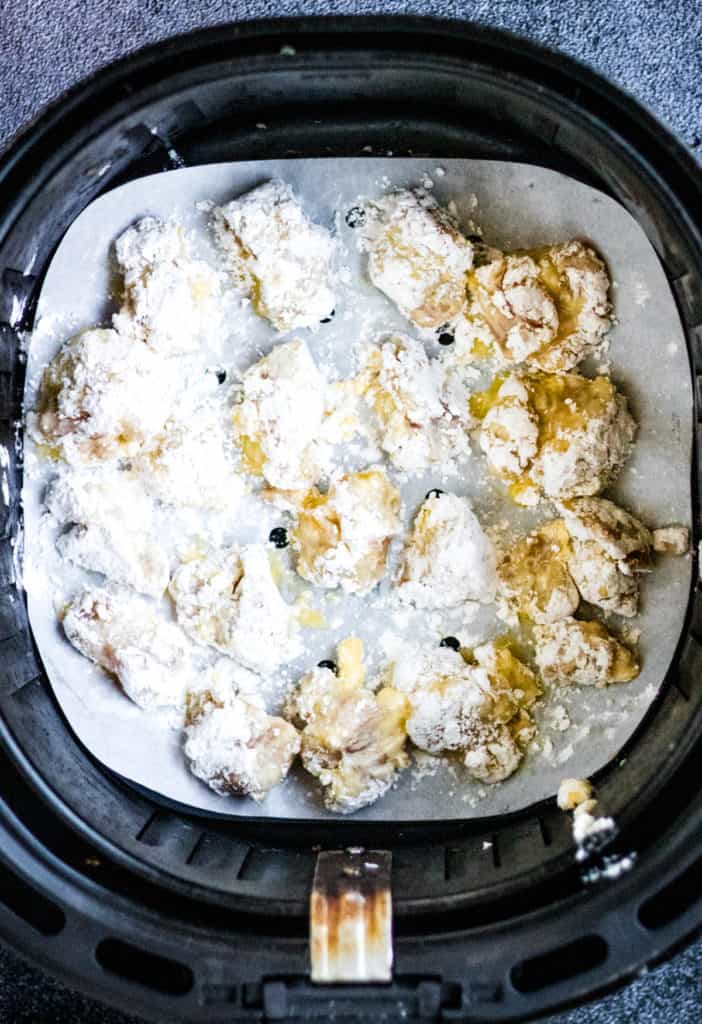 A slow cooker filled with a mixture of flour and powdered sugar, air fryer.