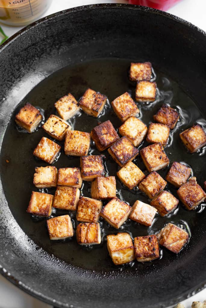 browned tofu in a skillet.