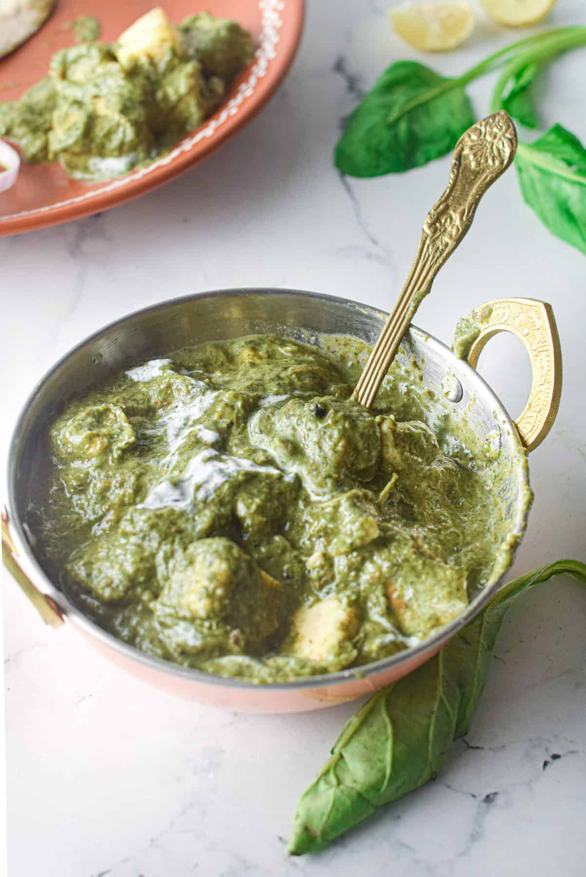 low angle shot of a bowl of palak paneer