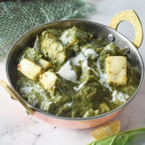 low angle shot of a bowl of instant pot palak paneer