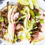 overhead shot of 3 Mexican shredded beef tacos