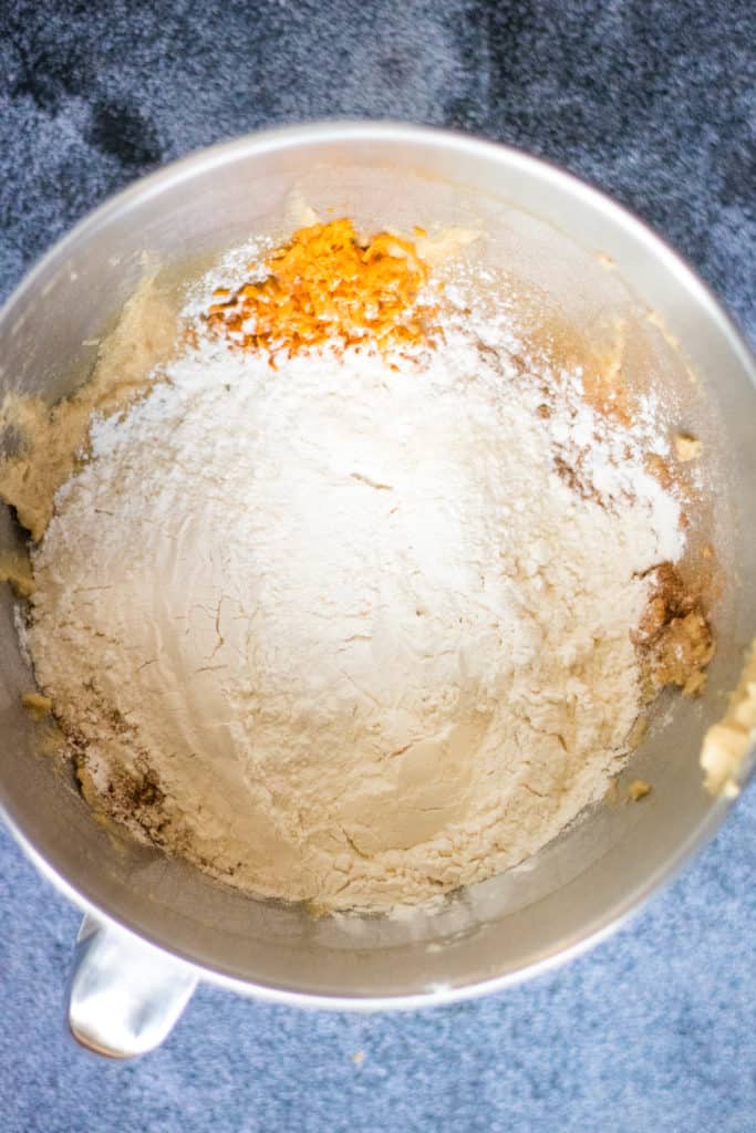 A bowl filled with honey and flour, used for making cookies.