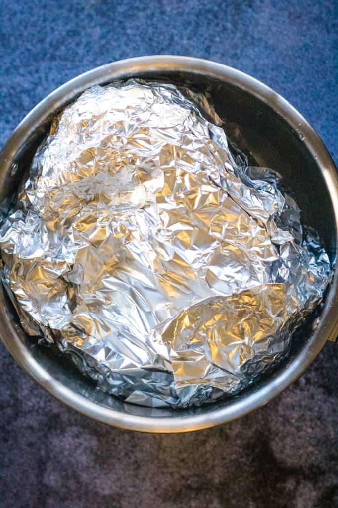 foil wrapped ham in the instant pot ready to cook