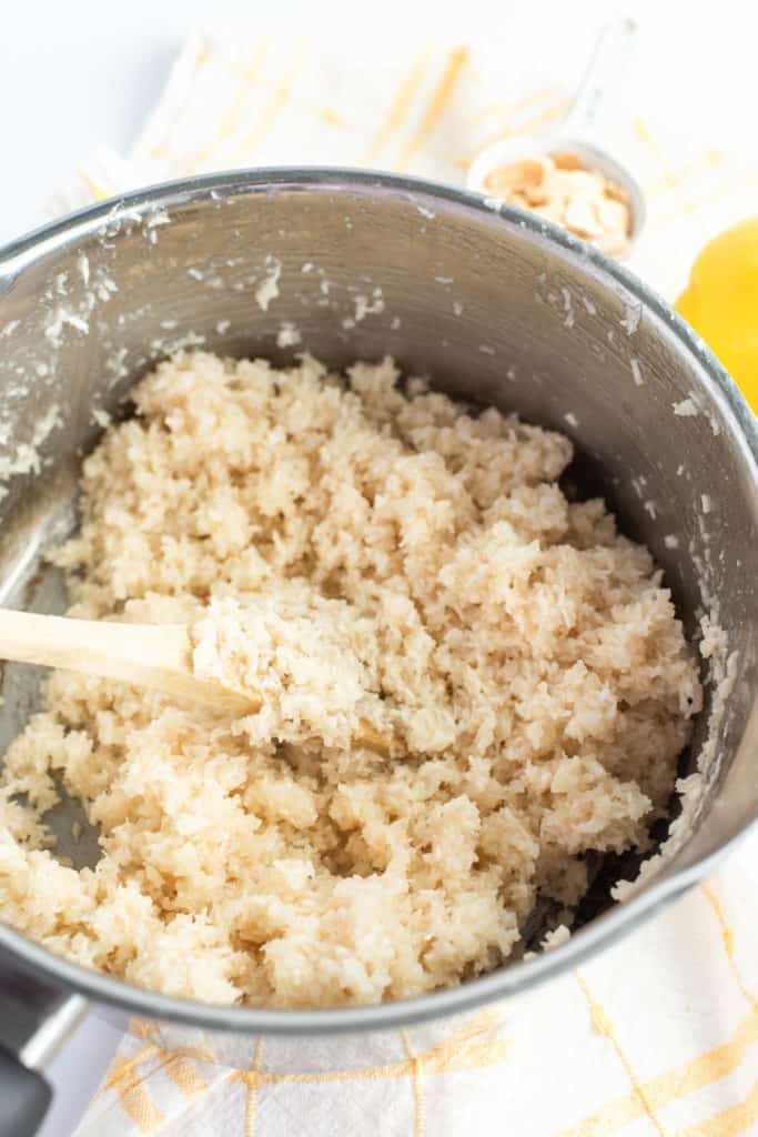 Lemon rice with coconut in a pan.