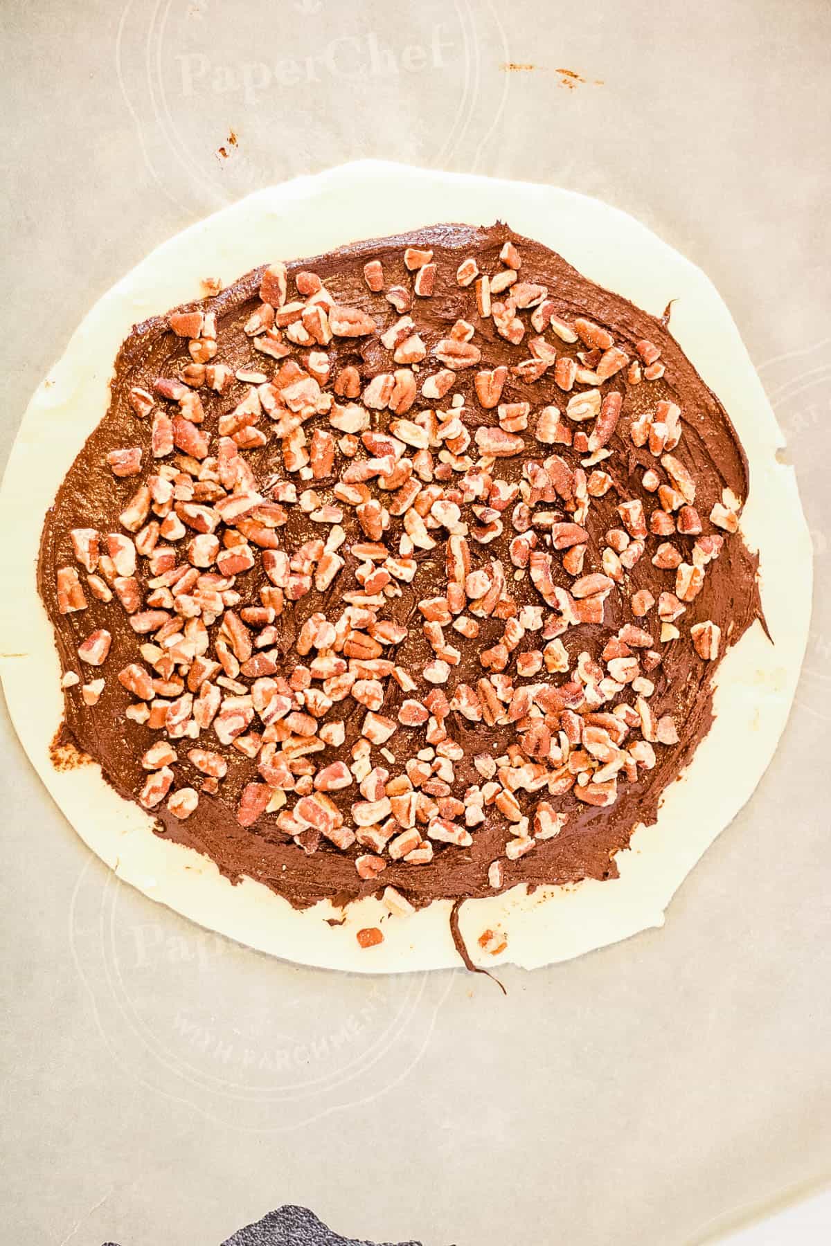 Pecans added on top of the chocolate.