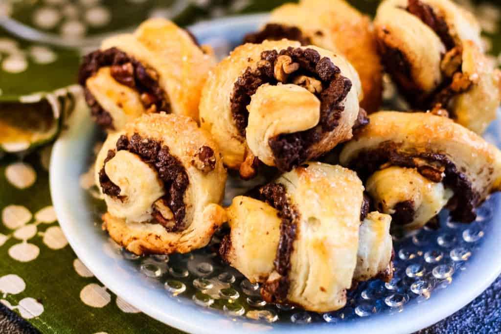 low angle shot of rugelach cookies filled with chocolate and pecans
