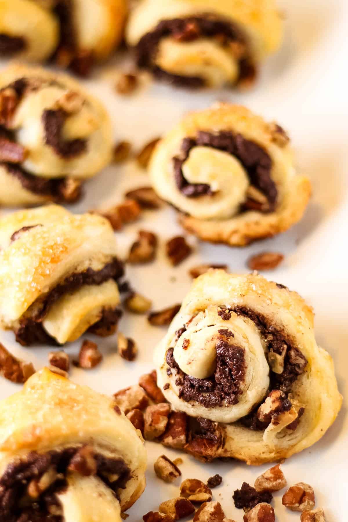 low angle shot of chocolate and pecan filled rugelach cookies