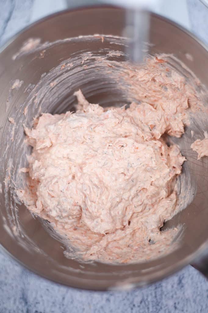 A bowl filled with a mixture of smoked salmon dip.