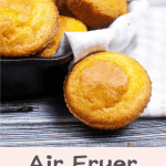 Golden-brown cornbread muffins in a baking tray with a text overlay describing them as "air fryer cornbread, tender, flavorful, and super quick and easy."