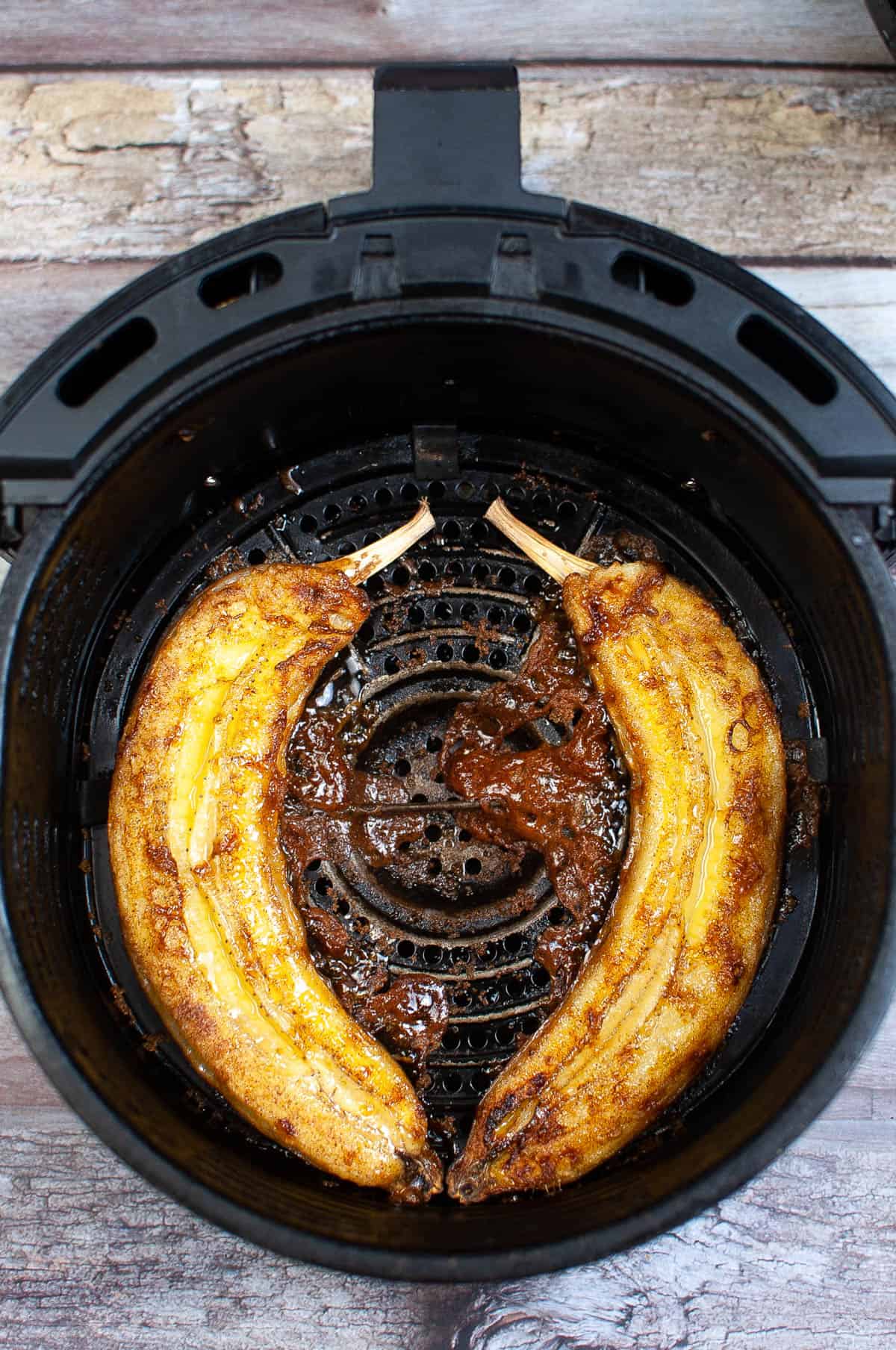 cooked bananas in the air fryer basket.
