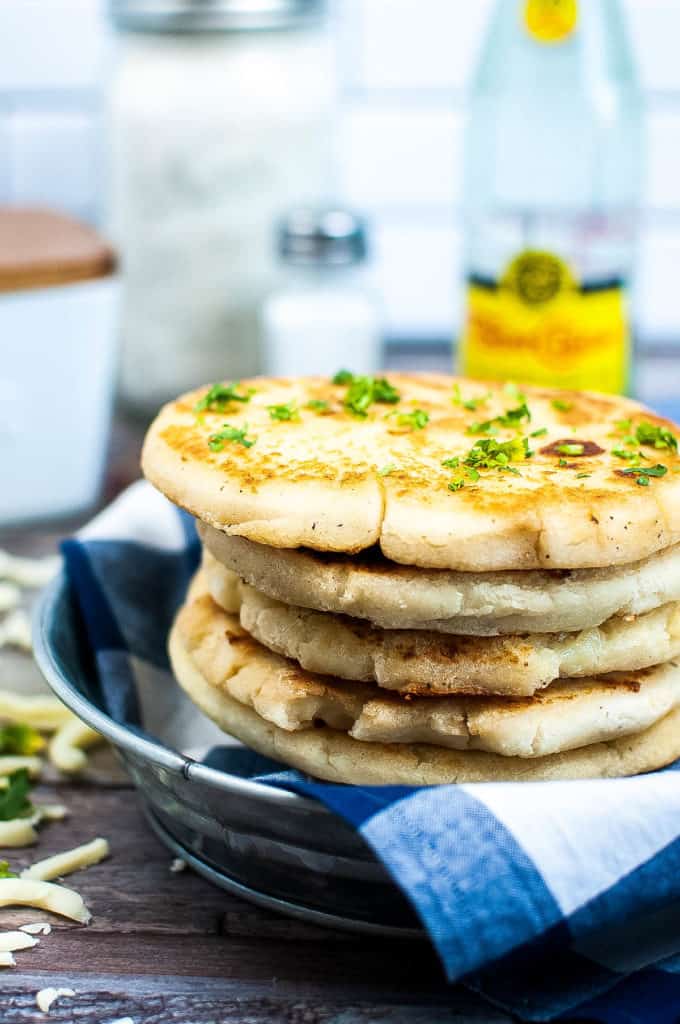 Low angle shot of a stack of arepas.
