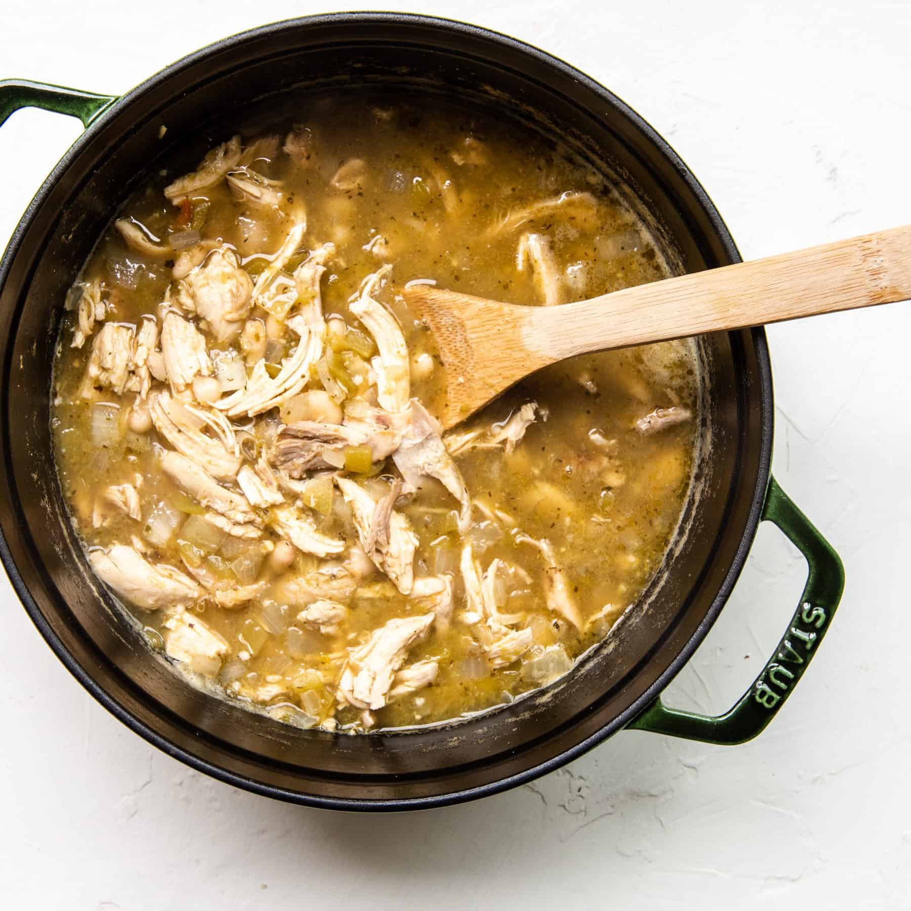Chicken soup with green chili in a pot.