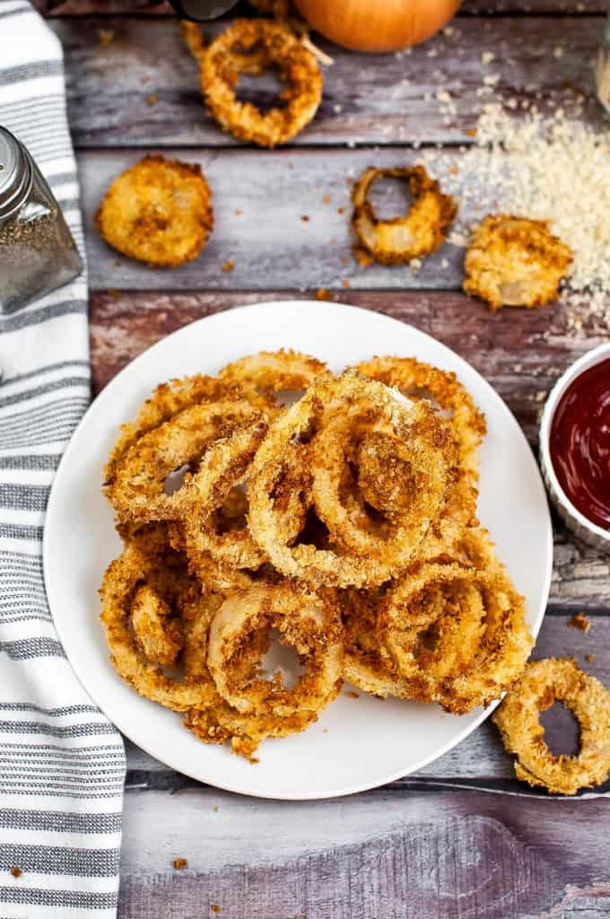 Overhead shot of a plate of air fried onion rings.