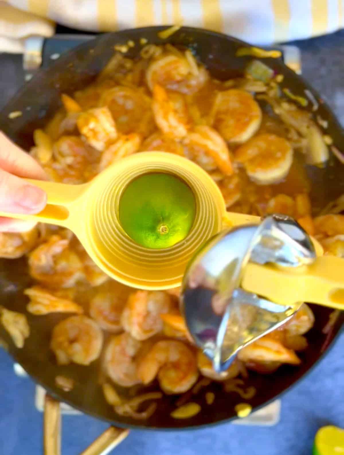 squeezing lime juice into the skillet.