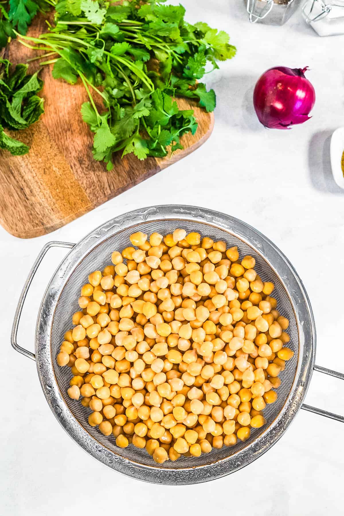 Chickpeas cooked in an air fryer with other ingredients to make falafel.