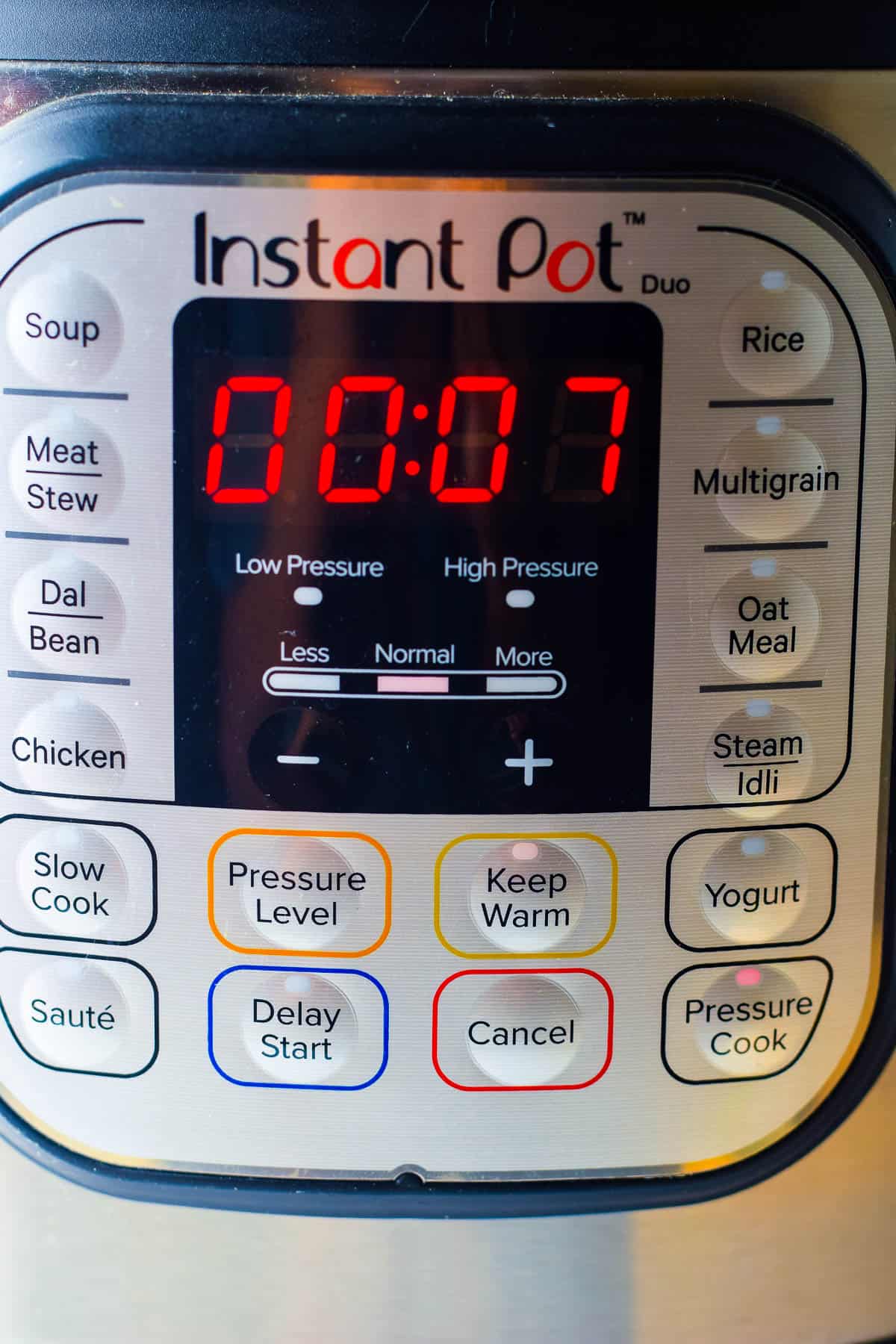 An Instant Pot with a built-in timer for cooking Instant Pot Chicken Korma.
