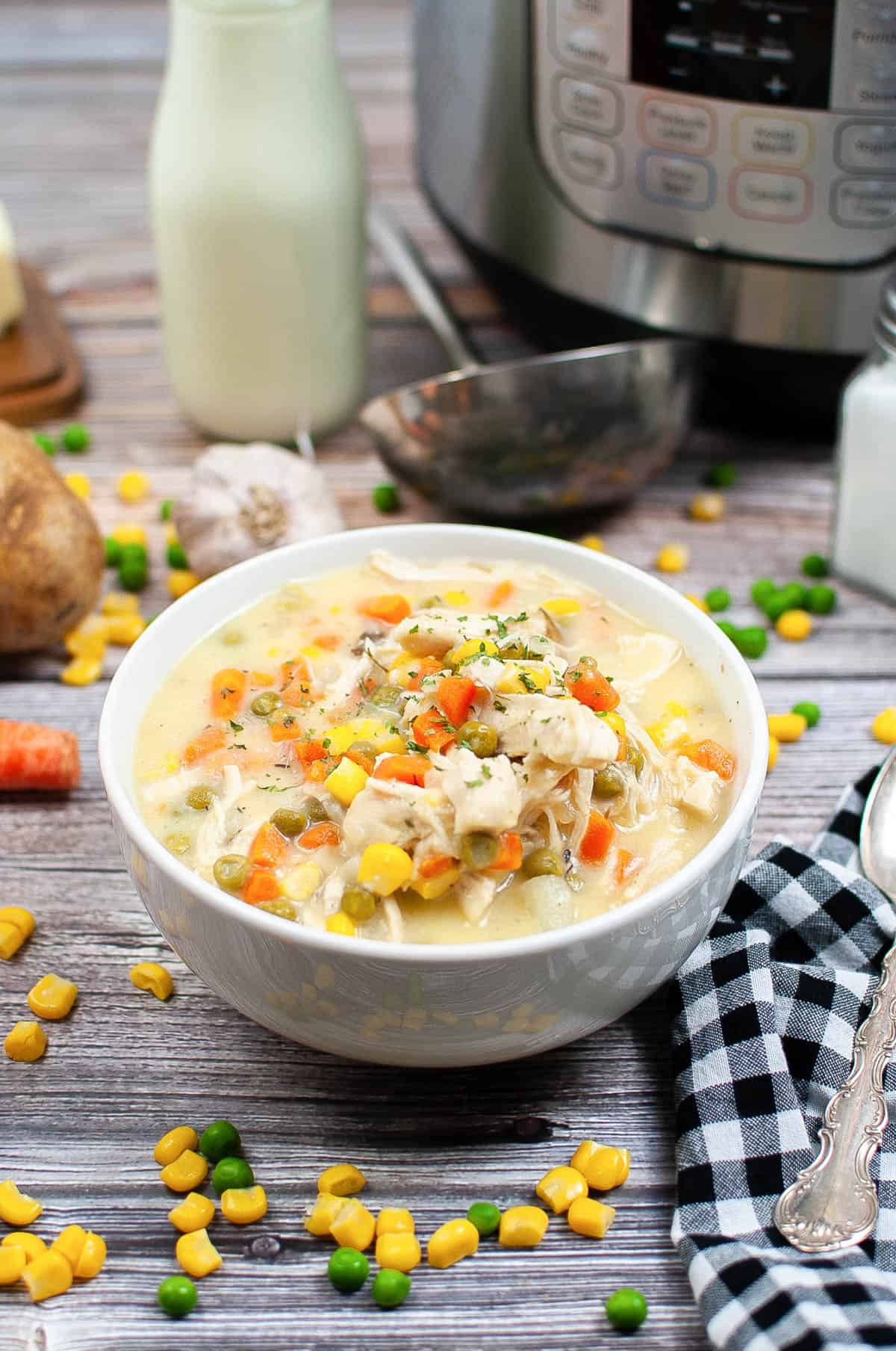 Low angle shot of a bowl of instant pot chicken pot pie soup.