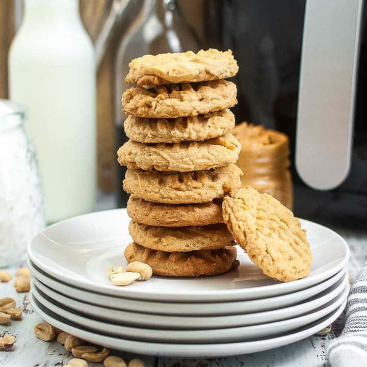 low angle shot of a stack of peanut butter cookies.