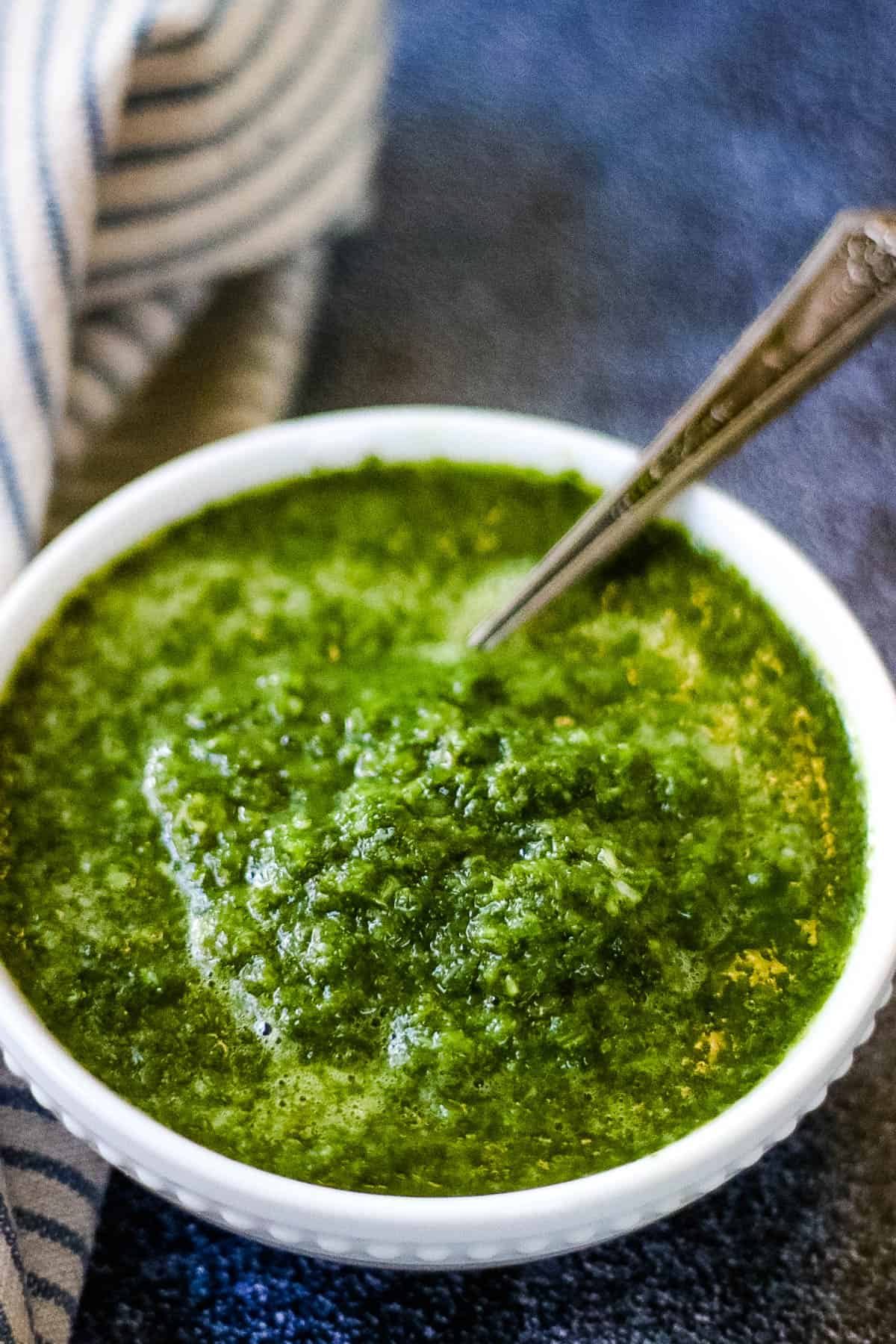 Low angle shot of a bowl of cilantro mint chutney.