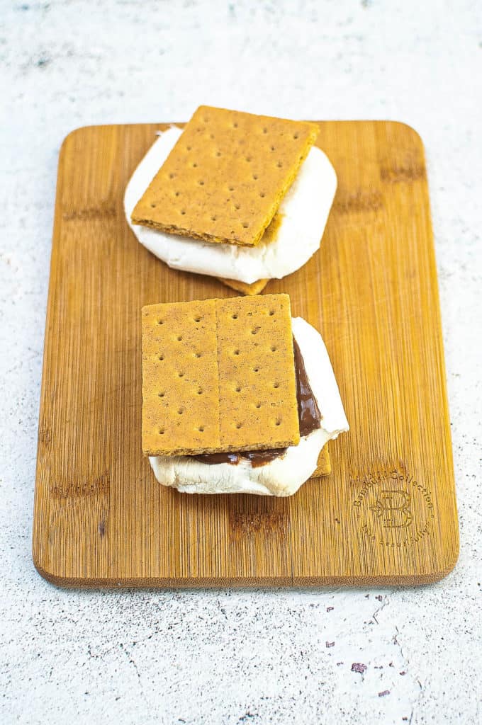 finished s'mores on a cutting board.