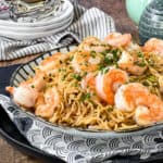 Low angle shot of a plate of shrimp yakisoba.