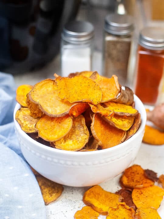 High angle shot of a bowl of sweet potato chips.