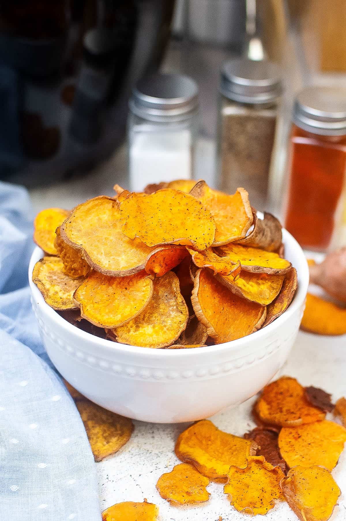 Low angle shot of a bowl of sweet potato chips.