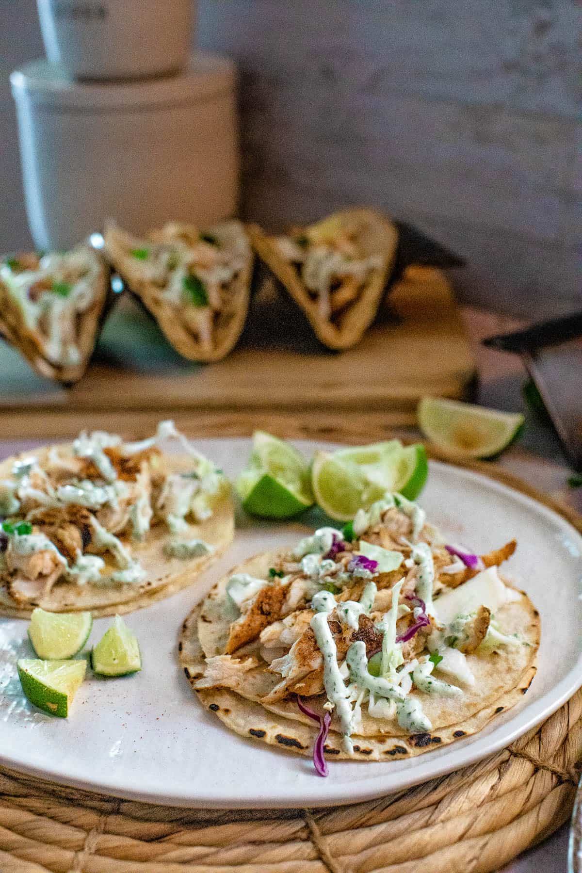 low angle shot of fish tacos on a plate.